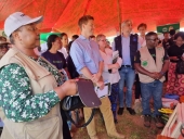 Minister of Gender Hon Jean Sendeza MP and Hugh Riddel visiting SSRLP pavilions during Multi-donor Trust Fund launch in Kasungu