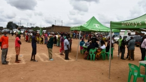  CUCI-Beneficiaries line up at Phwetekere in Lilongwe to redeem their payment.